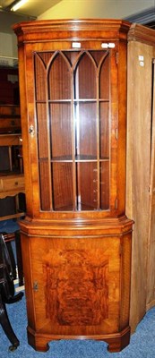 Lot 783 - A reproduction floor standing corner cupboard