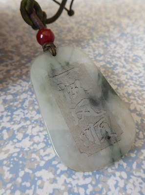 Lot 107 - A graduated jade bead necklace, length 73cm,...