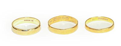 Lot 120 - Two 22 carat gold band rings, finger sizes M...