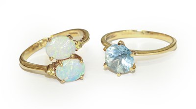 Lot 124 - A 9 carat gold opal twist ring, finger size N,...