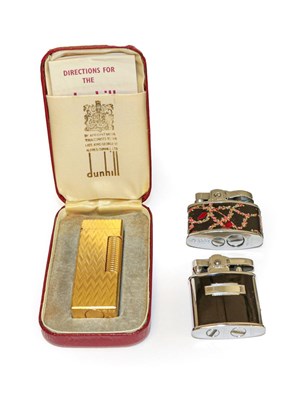 Lot 148 - A Dunhill Rollagas cigarette lighter, cased,...
