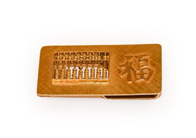 Lot 161 - An Oriental abacus money clip stamped '14K'...