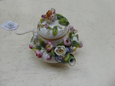 Lot 186 - Two Rockingham miniature teapots and covers,...