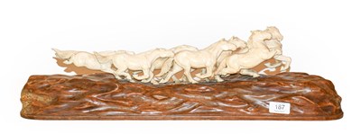 Lot 187 - An ivory horse group, raised on a wooden base,...