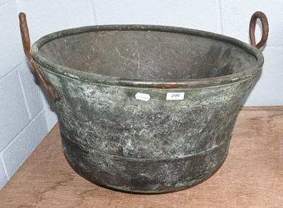 Lot 296 - A 19th century copper cauldron with twin iron...