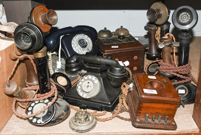 Lot 310 - Four 1920s stick telephones, together with...