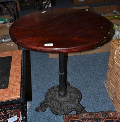 Lot 810 - Victorian cast iron pub table with circular mahogany top