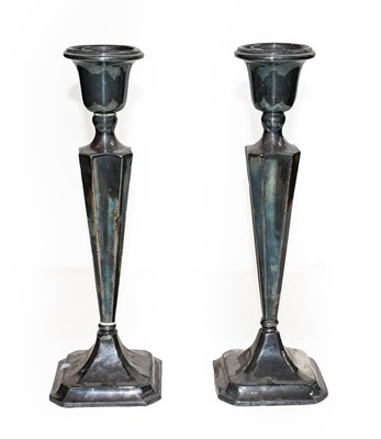 Lot 430 - A pair of George V silver candlesticks, by...