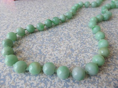 Lot 92 - A jade bead necklace, one hundred and eight...