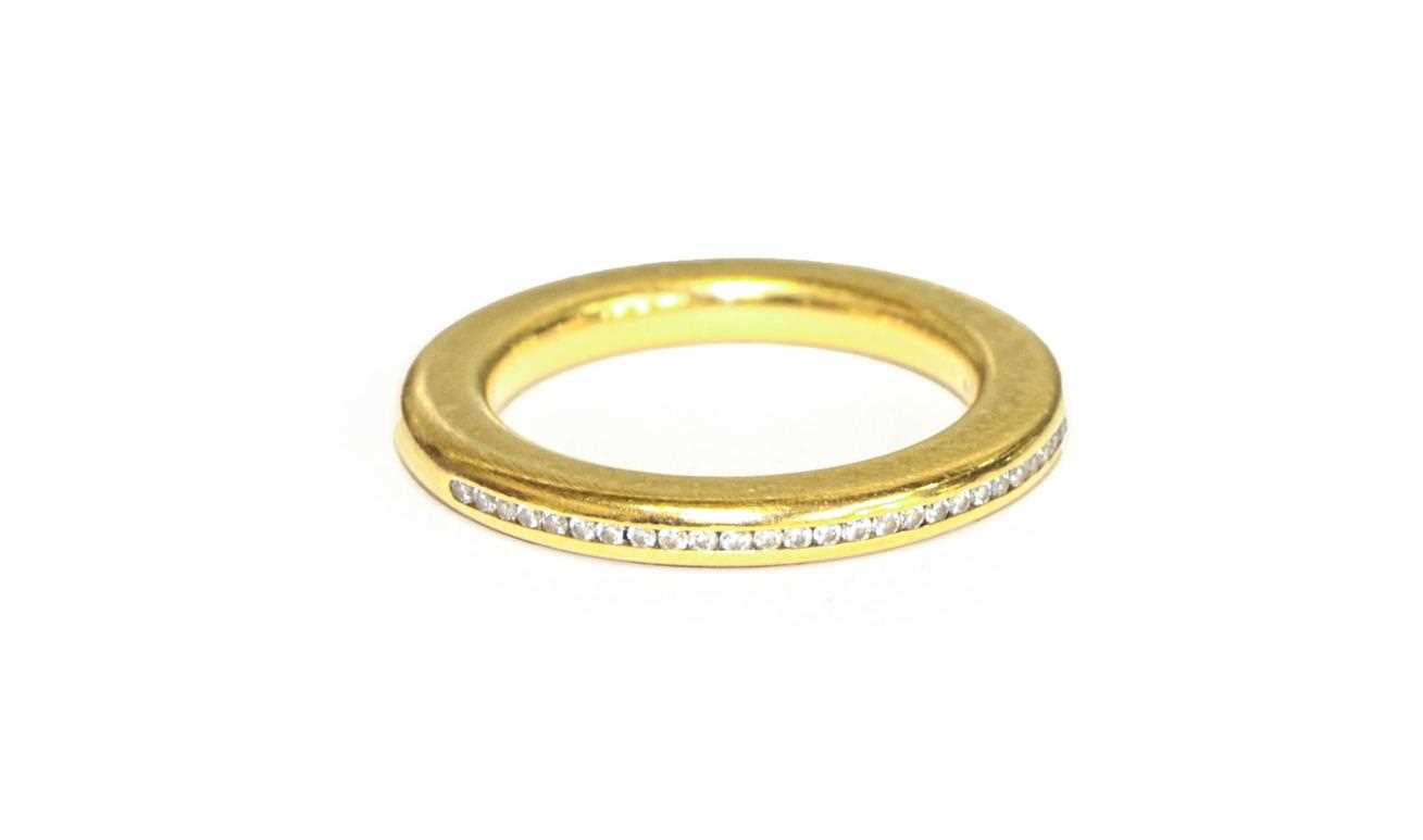 Lot 93 - An 18 carat gold diamond half hoop ring,...