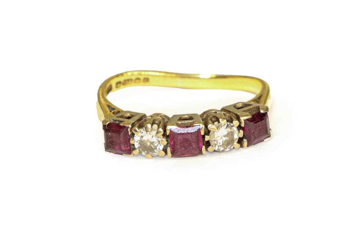 Lot 97 - An 18 carat gold ruby and diamond five stone...
