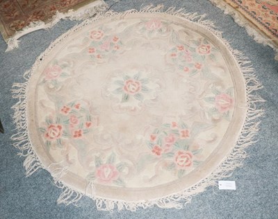 Lot 1154 - A machine made rug of Oriental design, the...
