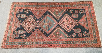 Lot 1155 - Hamadan rug, the indigo field with three...