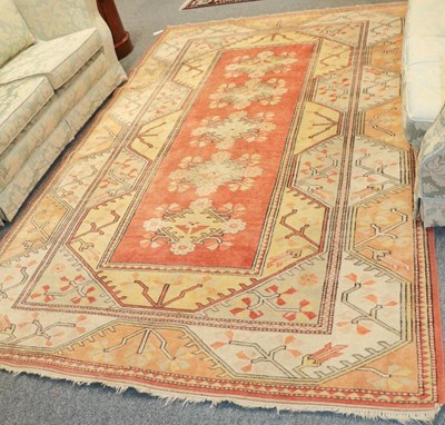 Lot 1162 - Melas carpet, the pale terracotta field with...