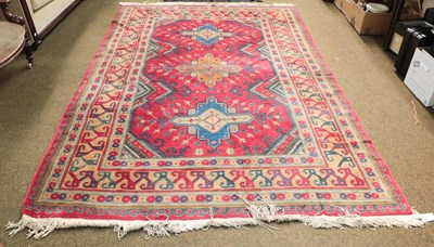 Lot 1170 - Caucasian design rug, the field with three...