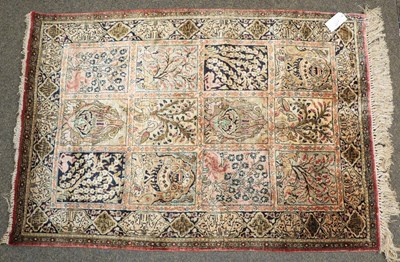 Lot 1171 - Ghom silk rug, the compartmentalised field...
