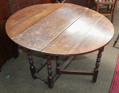 Lot 1211 - An 18th century oak gate leg table, 107cm by...