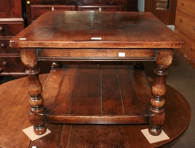 Lot 1220 - An oak coffee table with shelf stretcher,...