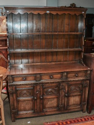 Lot 1224 - A 20th century carved oak dresser and rack...