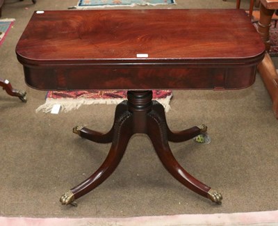 Lot 1235 - A Regency mahogany fold over tea table, 93cm...