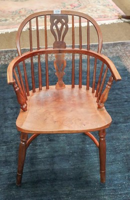 Lot 1238 - A yew wood Windsor chair