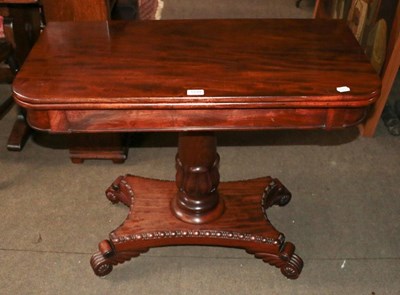 Lot 1239 - A Regency mahogany foldover tea table on X...