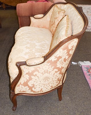 Lot 1253 - A 20th century French carved walnut two seater...
