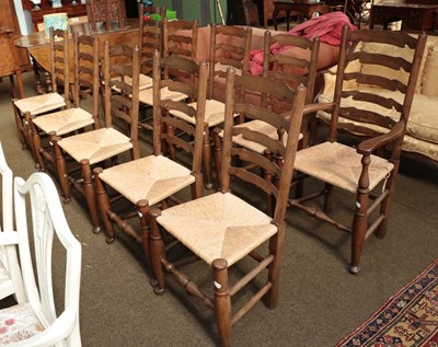 Lot 1255 - A set of ten oak ladder back dining chairs...