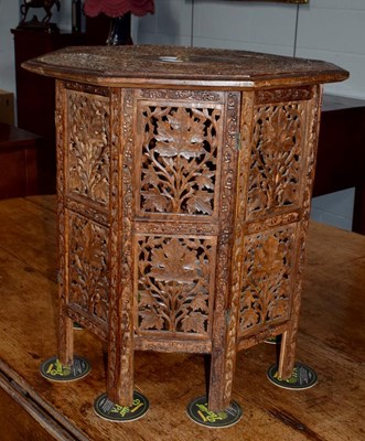 Lot 1263 - A carved octagonal folding table, 52cm square...
