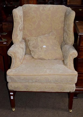 Lot 1287 - A Georgian style mahogany framed wing chair