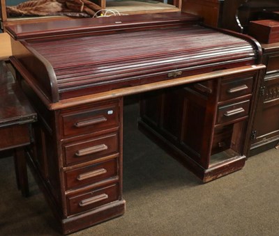 Lot 1309 - A 1920's mahogany roll top twin pedestal desk,...