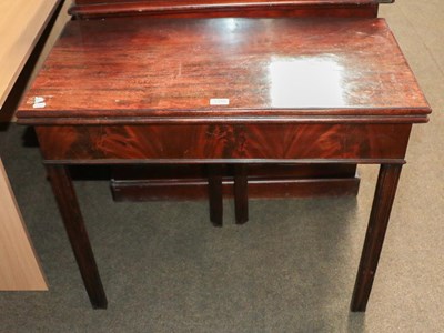 Lot 1310 - A George III mahogany foldover tea table...
