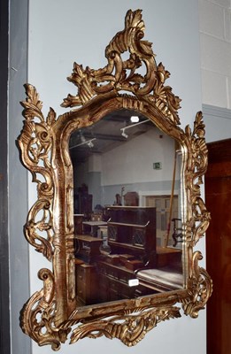 Lot 1319 - A Roccoco style gilt framed hall mirror,...