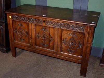 Lot 1321 - An 18th century oak three panel coffer with...