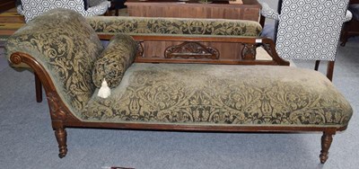 Lot 1336 - A late Victorian carved mahogany chaise longue...