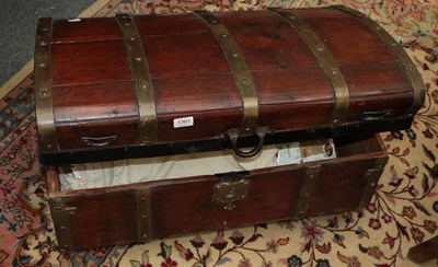 Lot 1361 - A brass bound dome top trunk with waisted body,...