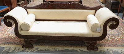 Lot 1364 - A modern carved mahogany scroll arm sofa in...