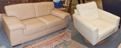Lot 1383 - A beige leather two seater sofa, 200cm by 94cm...
