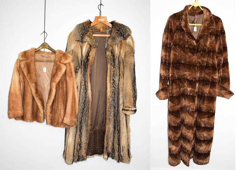 Lot 1051 - A brown textured full length fur coat, a Jean...