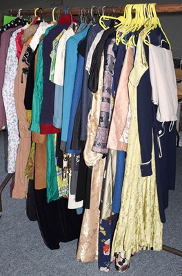 Lot 1056 - An assortment of clothing, to include: ladies...