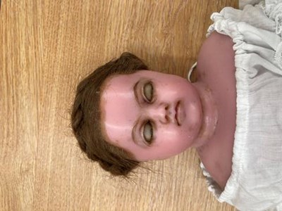Lot 1074 - Wax head doll Montanari doll, with remains of...