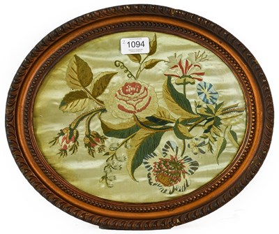Lot 1094 - A Georgian embroidered silk panel of flowers...