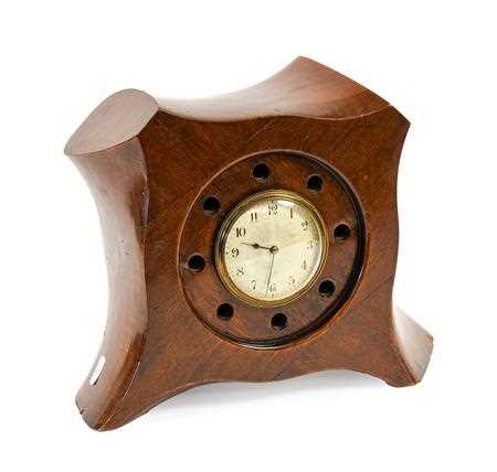 Lot 25 - A Laminated Mahogany Mantel Timepiece, made...