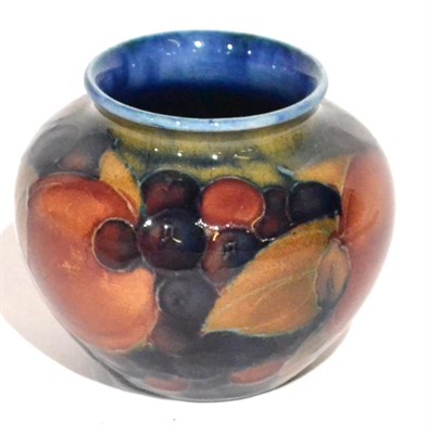 Lot 4 - A William Moorcroft Pomegranate Pattern Vase, on a blue ground, impressed MOORCROFT ENGLAND...