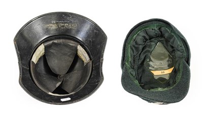 Lot 73 - A German Third Reich Luftshutz Helmet, painted...