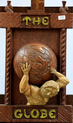 Lot 1187 - A carved hanging plaque inscribed 'The Globe',...