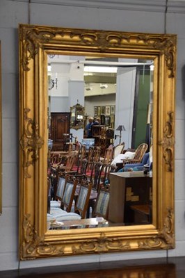 Lot 1234 - A reproduction gilt framed mirror with...