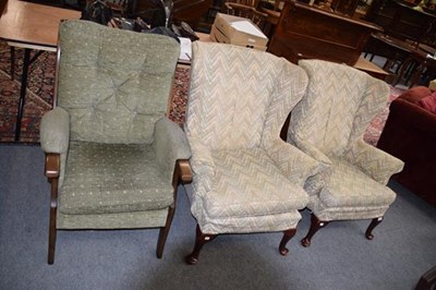Lot 1261 - A pair of 20th century wingback armchairs...