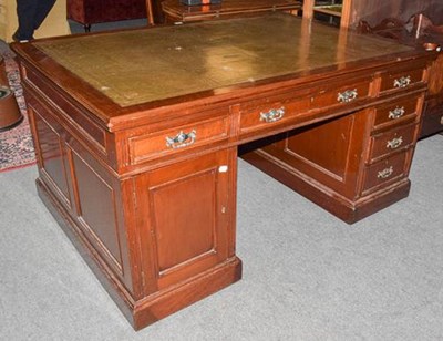 Lot 1266 - A mahogany reproduction partners' desk stamped...
