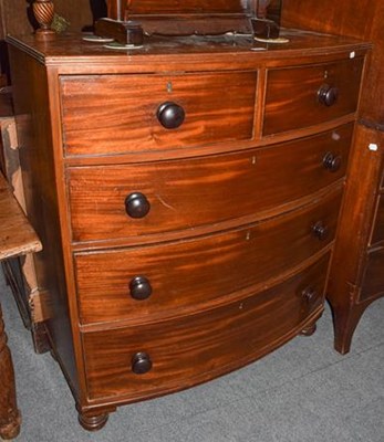 Lot 1282 - An early Victorian four-height bow front chest...